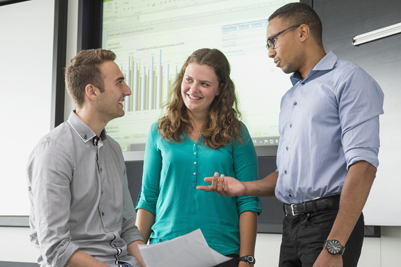 Three trainees in conversation