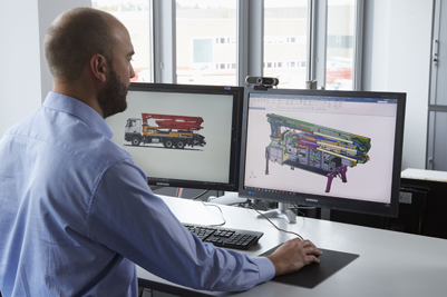 Employee in front of CAD screen